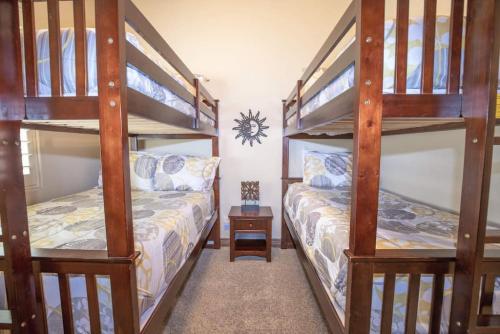 a bedroom with two bunk beds and a table at 1906 Pebble Beach Retreat in Washington