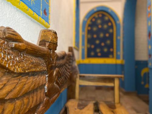 a toy room with a wooden bed and a bench at Kato Dool Wellness Resort in Aswan