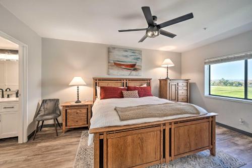a bedroom with a bed and a ceiling fan at Resort-Style Lake Havasu City Condo with Pool! in Lake Havasu City