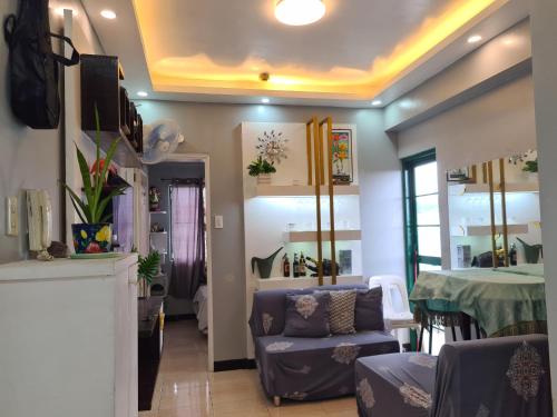 a living room with a couch and a table at Budget Friendly Transient in Cainta in Cainta