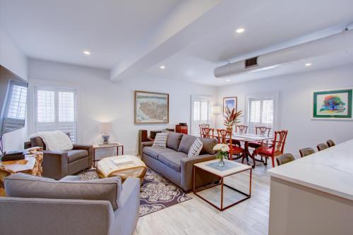 a living room with a couch and a table at The Charleston Chestnut Mansion in Charleston