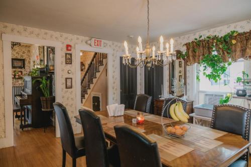 a dining room with a table and chairs at The Greenfield Inn in Greenfield