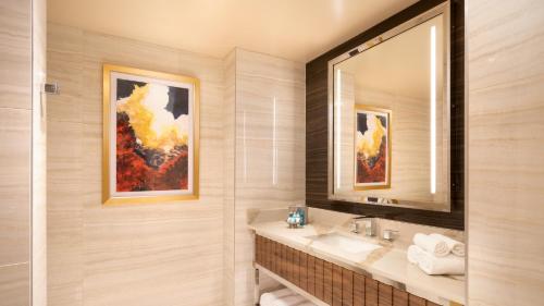 a bathroom with a sink and a mirror at Grand Sierra Resort and Casino in Reno