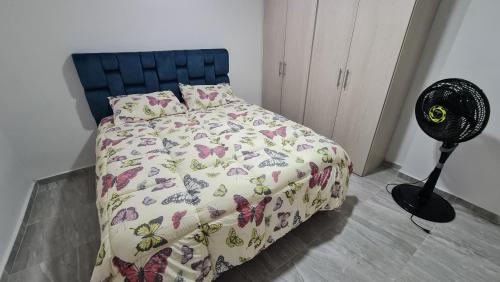 Postel nebo postele na pokoji v ubytování Apartamento Entero Ibague - Parqueadero - Nogal