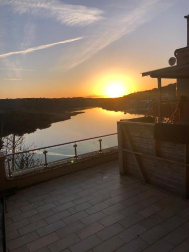 a view of a sunset from a balcony at The Loft @ Clifden Bay Apartments in Clifden