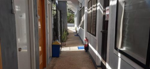 an empty hallway of a building with at Ezekiel Transient House in Coron