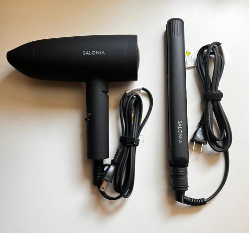 a black hair dryer sitting on a table at Second Home 瀬戸風月 in Takamatsu