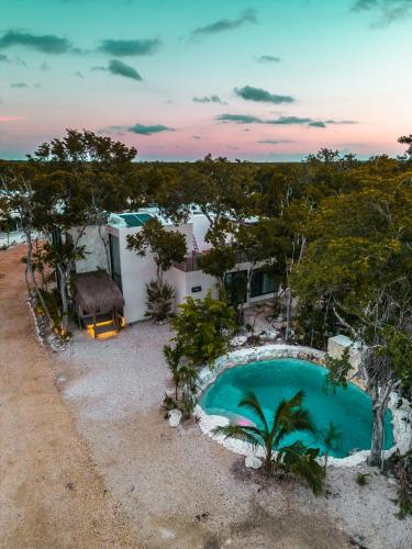 an overhead view of a pool in front of a house at Jungle-chic luxurious Tulum home in Tulum