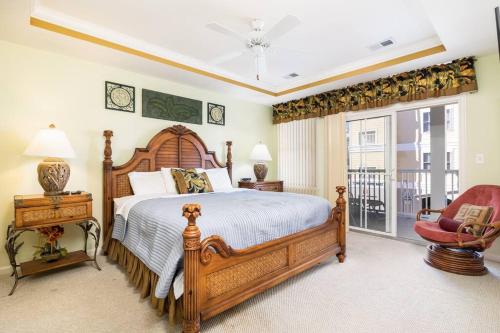 a bedroom with a large wooden bed and a chair at PARADISE AT SUNSET ISLAND in Ocean City