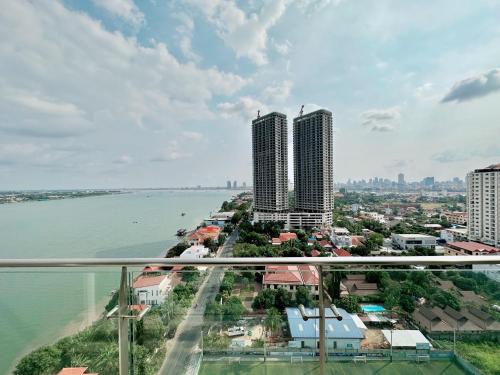 a view of a city and a body of water at Infinity 28 Hotel and Residence in Phnom Penh