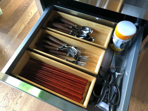 a drawer in a kitchen with utensils in it at 古民家の宿 紋七 Kominka-no-yado-"Monshichi---BBQ-駅から5分-併設店舗で飲食可 in Mobara