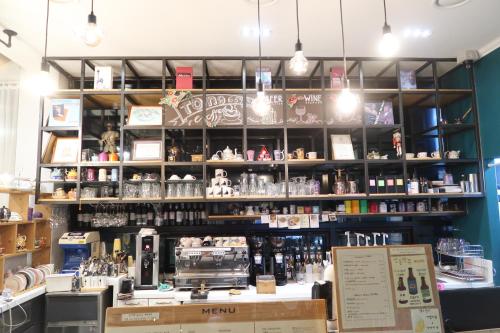 a shop with a counter and shelves with products at Andong Poong-gyung HOSTEL n LIBRARY in Andong