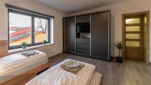 Postel nebo postele na pokoji v ubytování Apartmány Lucie