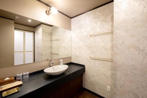 Koupelna v ubytování Kamisuwa Onsen Shinyu