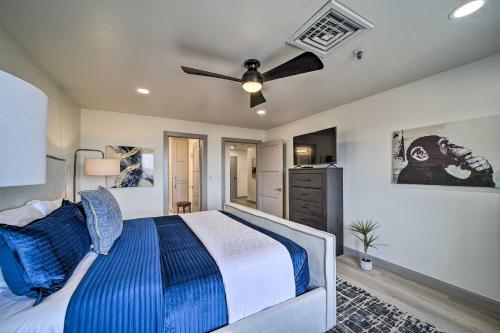 a bedroom with a bed and a ceiling fan at Balcony & Lake View: Modern Condo in Monkey Island in Monkey Island