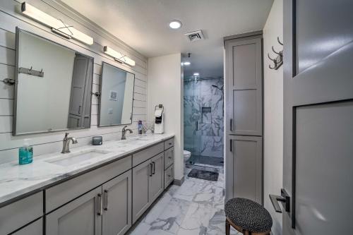 a bathroom with two sinks and a shower at Balcony & Lake View: Modern Condo in Monkey Island in Monkey Island