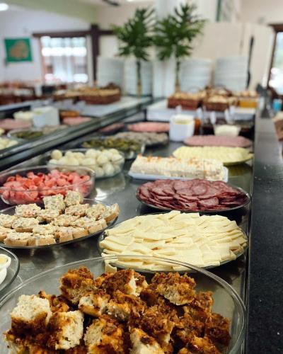 a buffet line with many different types of food at Cabana na Serra Gaúcha! in Picada Cafe