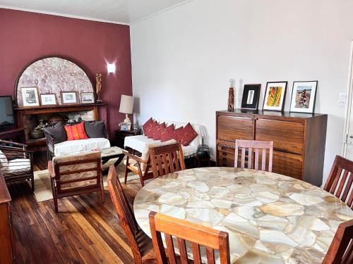 a living room with a table and chairs at Bed&Breakfast VANILLA in Antsirabe