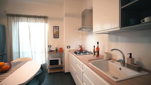 a kitchen with a sink and a counter top at Mi Tierra Luxury Apartments in Palermo