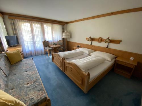 Ένα ή περισσότερα κρεβάτια σε δωμάτιο στο Hotel B&B Casa La Val