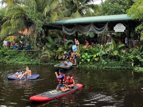 a group of people on rafts in the water at LAGI FARMSTAY in La Gi