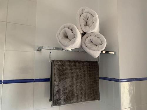 two donuts on a shelf on a wall at Casa Pueblo Overlooking the Village of Lubrín! in Lubrín