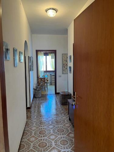 a hallway with a door leading to a living room at VillaMarinaPigra Lake View Apartments in Pigra