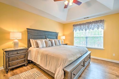 een slaapkamer met een groot bed en een raam bij Georgia Retreat with Furnished Deck and Grill! in Austell
