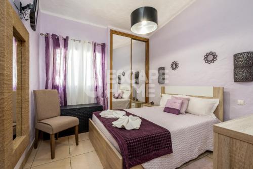 מיטה או מיטות בחדר ב-Villa Concha do Mar