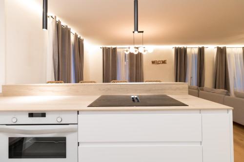 a kitchen with a white island with a counter top at Arriaga in Bilbao