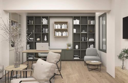 a living room with a desk and chairs at Alissachni SeaSide Hotel in Derveni