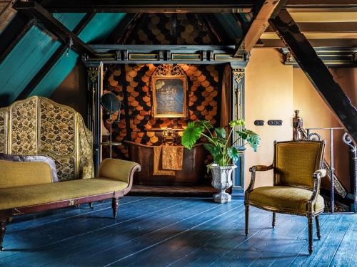 a living room with two chairs and a table at Private and chique Salon de Franz in Amsterdam