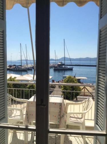 a view of a marina with boats in the water at Giannis Rooms in Methana