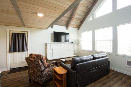 a living room with a couch and a tv at Tidal House 9 in Ocean Shores