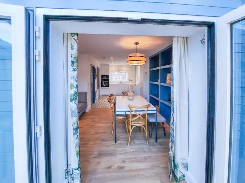 a dining room and kitchen with a table and chairs at The Kinsale 4 Center in Kinsale