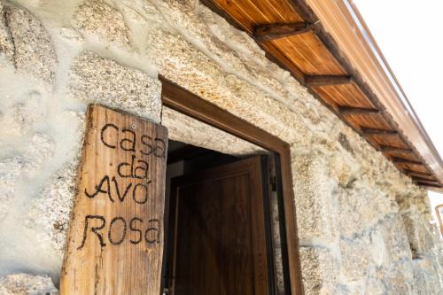 a door to a building with a sign on it at Matos Casas de Campo in Cabeceiras de Basto