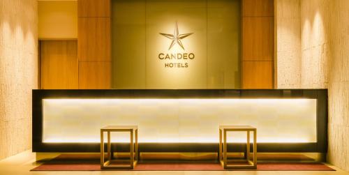 a counter with two stools in front of a store at Candeo Hotels Fukuoka Tenjin in Fukuoka