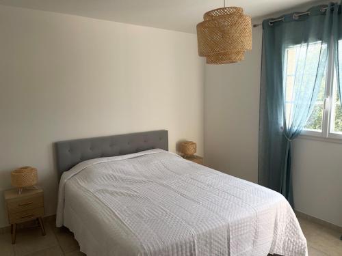 a bedroom with a bed and a window at La Bastide Cezanne Natural elegance in Aix-en-Provence