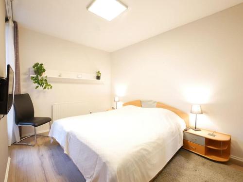 A bed or beds in a room at 61 m2 Erdgeschosswohnung mit eigenem Parkplatz vorm Haus