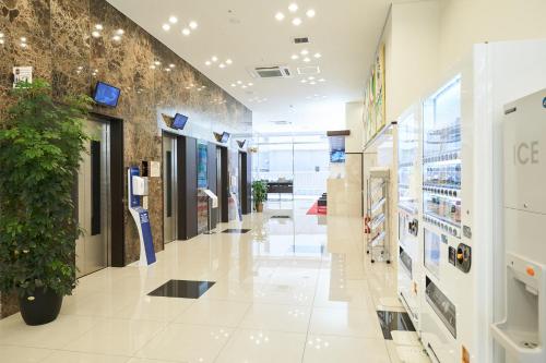 a shopping mall hallway with a potted plant at Toyoko Inn Nagoya Kanayama in Nagoya
