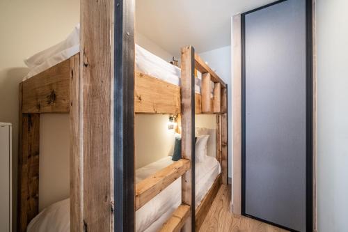a bunk bed room with two bunk beds at Apartment Kanoko Les Gets- BY EMERALD STAY in Les Gets