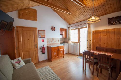 a kitchen and dining room with a table and chairs at Holiday Home Tatralandia in Liptovský Mikuláš