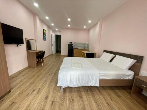 Ένα ή περισσότερα κρεβάτια σε δωμάτιο στο Aspire Saigon - Ly Tu Trong