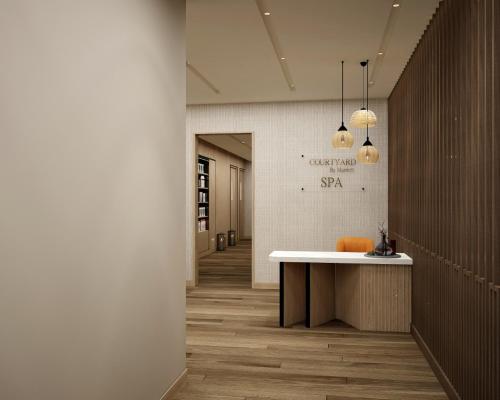 a hallway with a counter in a building with a hallway sidx sidx at Courtyard by Marriott Shillong in Shillong