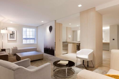 a living room with a couch and a table at Hyatt Grand Central New York in New York
