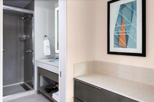 a bathroom with a shower and a sink at Hyatt House Charlotte Rea Farms in Charlotte