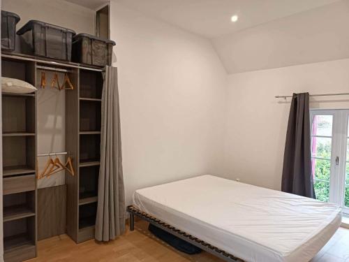 Posteľ alebo postele v izbe v ubytovaní La maison du voisin