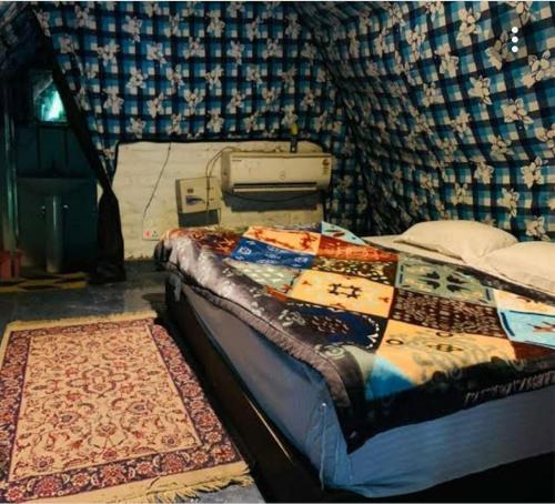 Llit o llits en una habitació de Aita River Resort