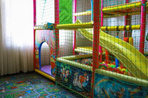 a play room with a slide in a play room at Continental SPA Resort in Bukovel