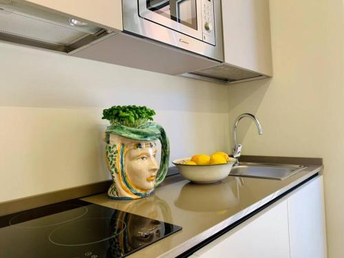 O bucătărie sau chicinetă la Alex Charme Central Apartments - Corso Umberto Taormina